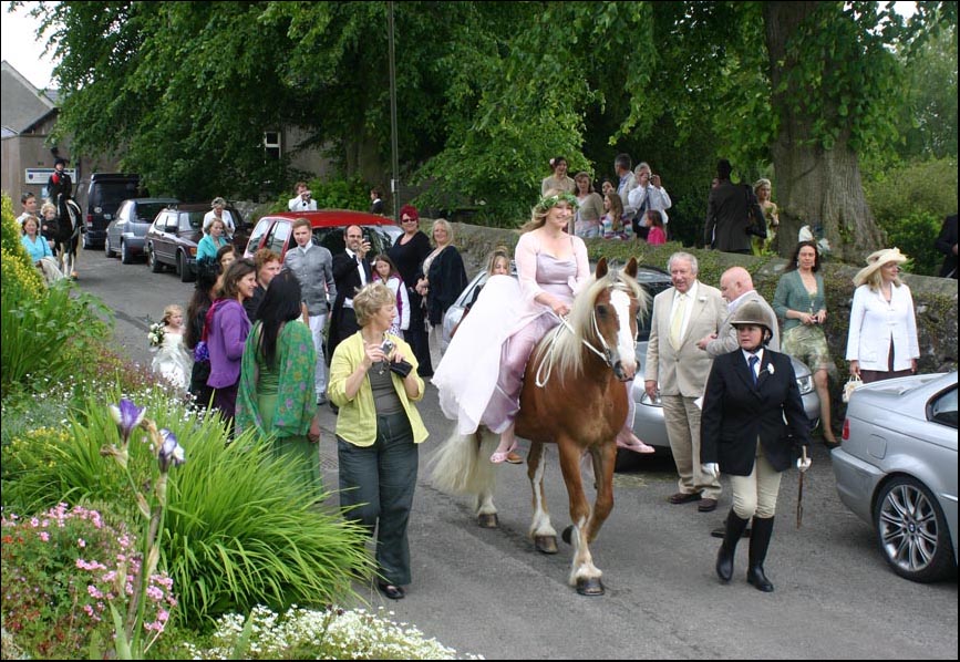bride arriving on horseback